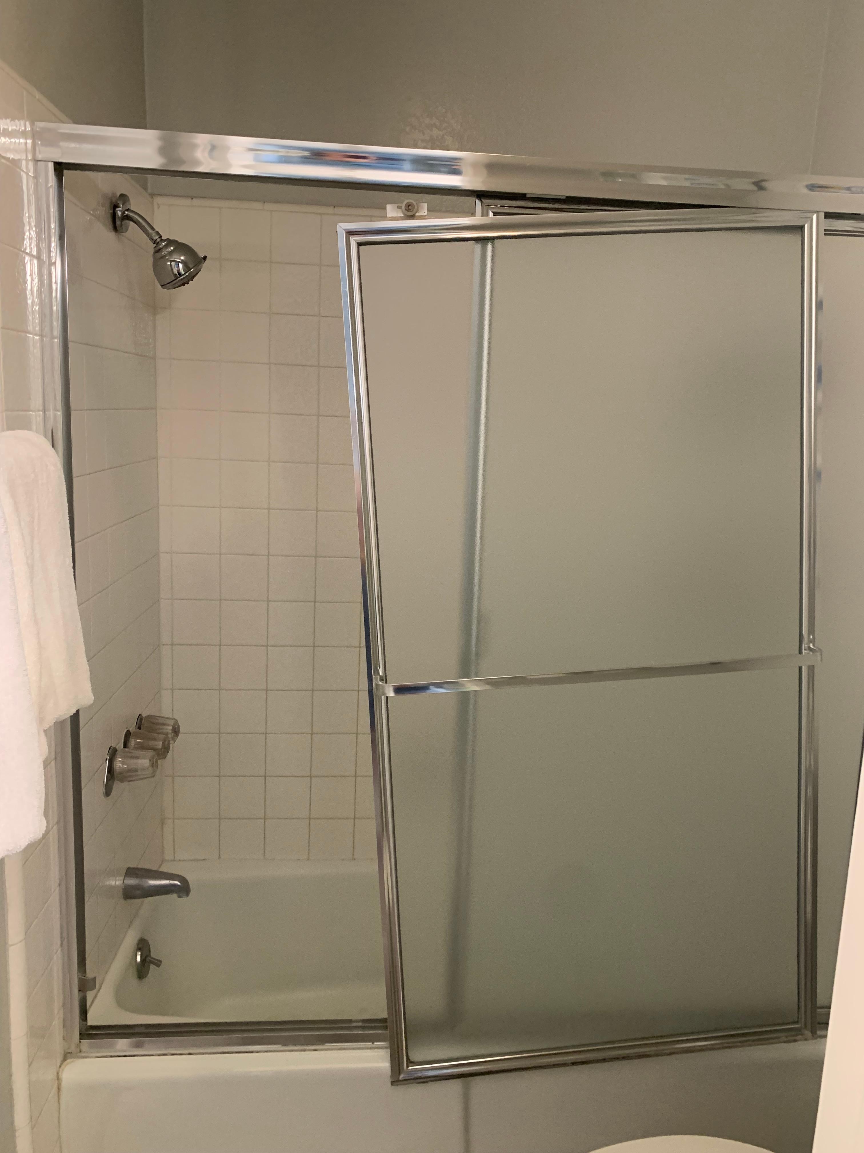 Downstairs shower door fell off the track.