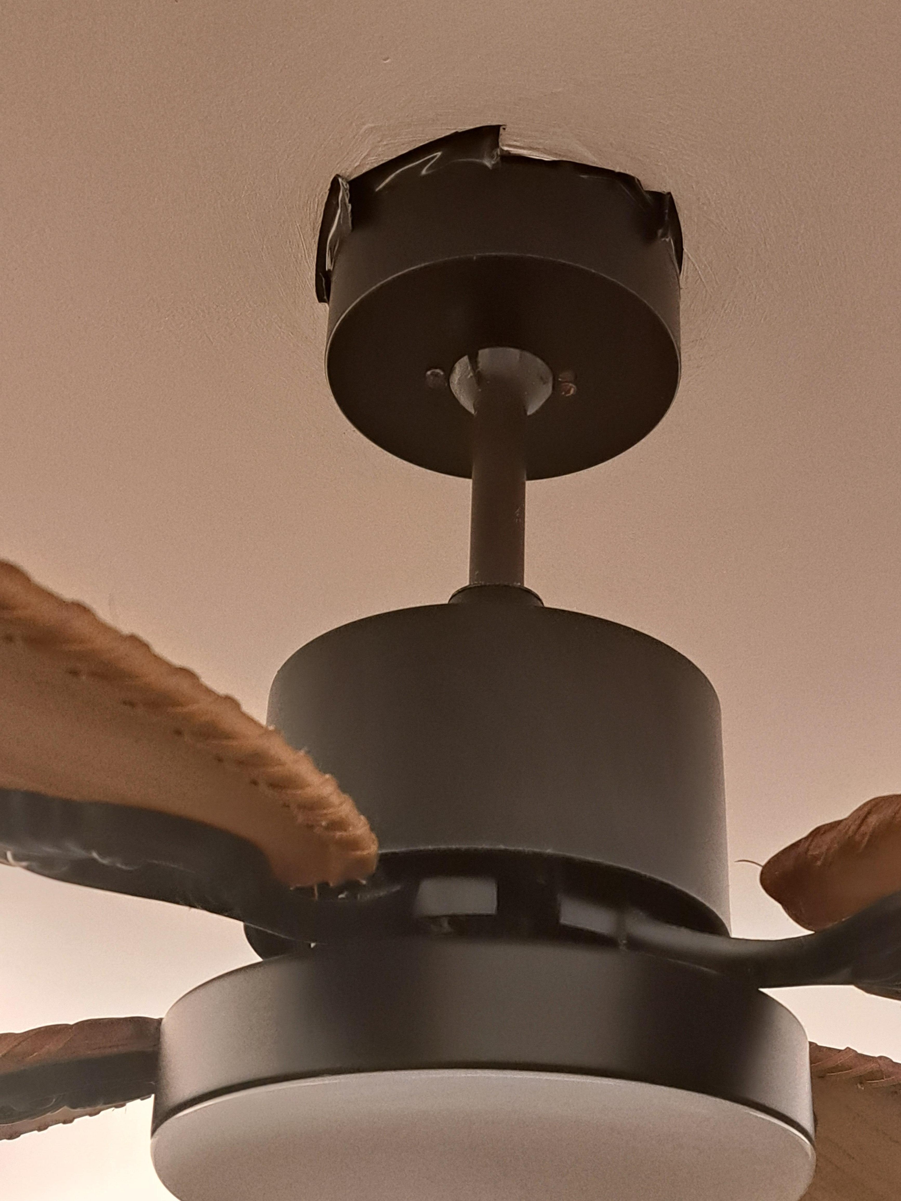 Black tape around ceiling fan