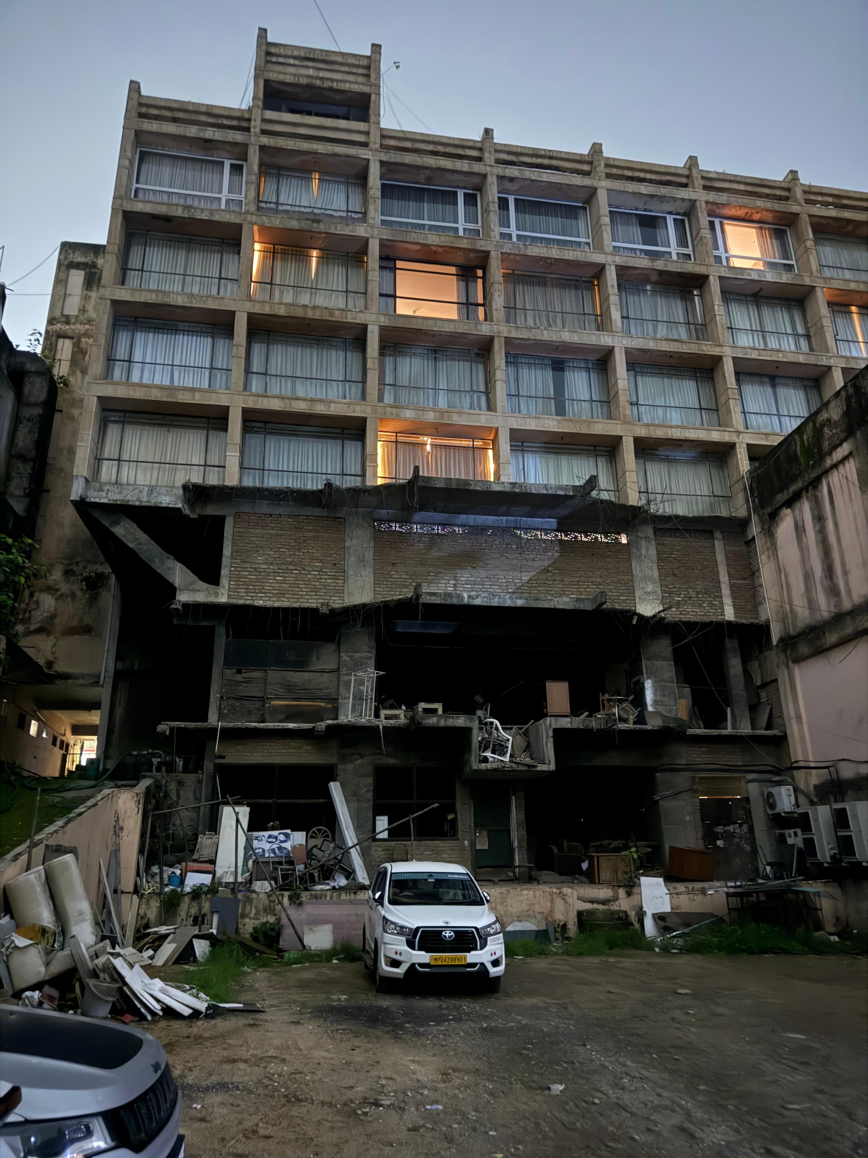 This is the condition of the hotel from behind. This view is from the parking lot of the hotel. 