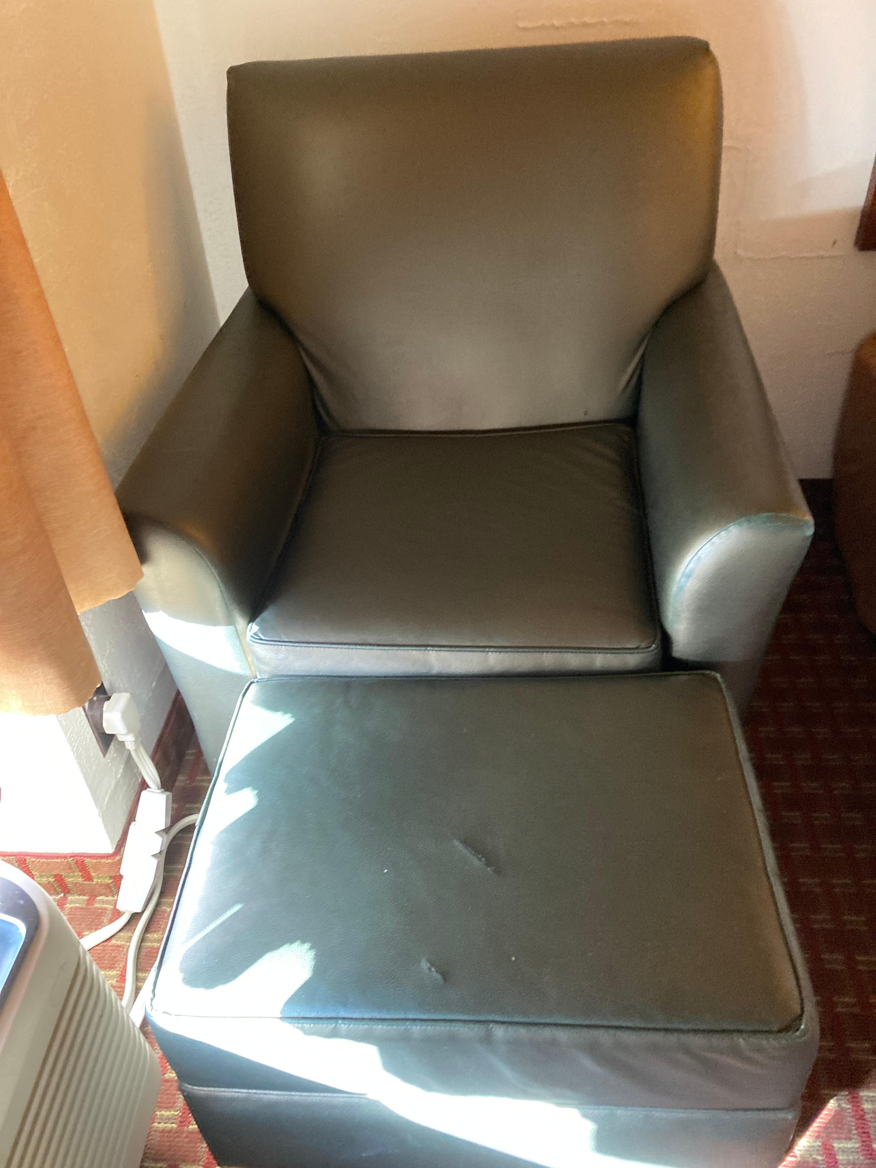 Stuffed chair and foot rest.