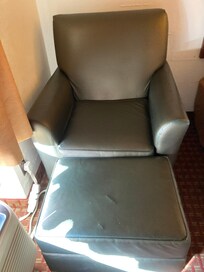 Stuffed chair and foot rest.