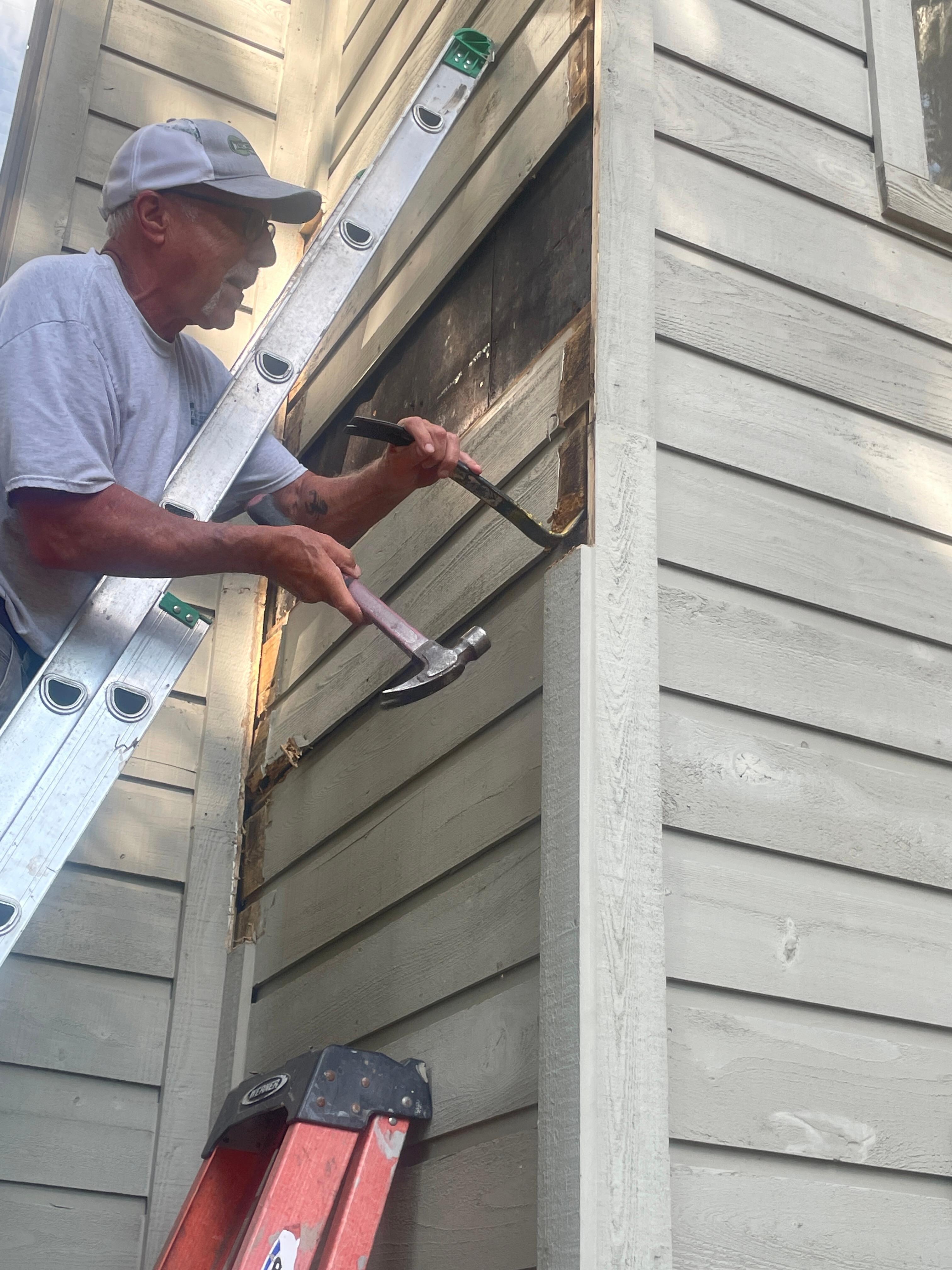 This gentleman was hammering on the side of our unit working on replacing rotted wood on the unit during our stay.