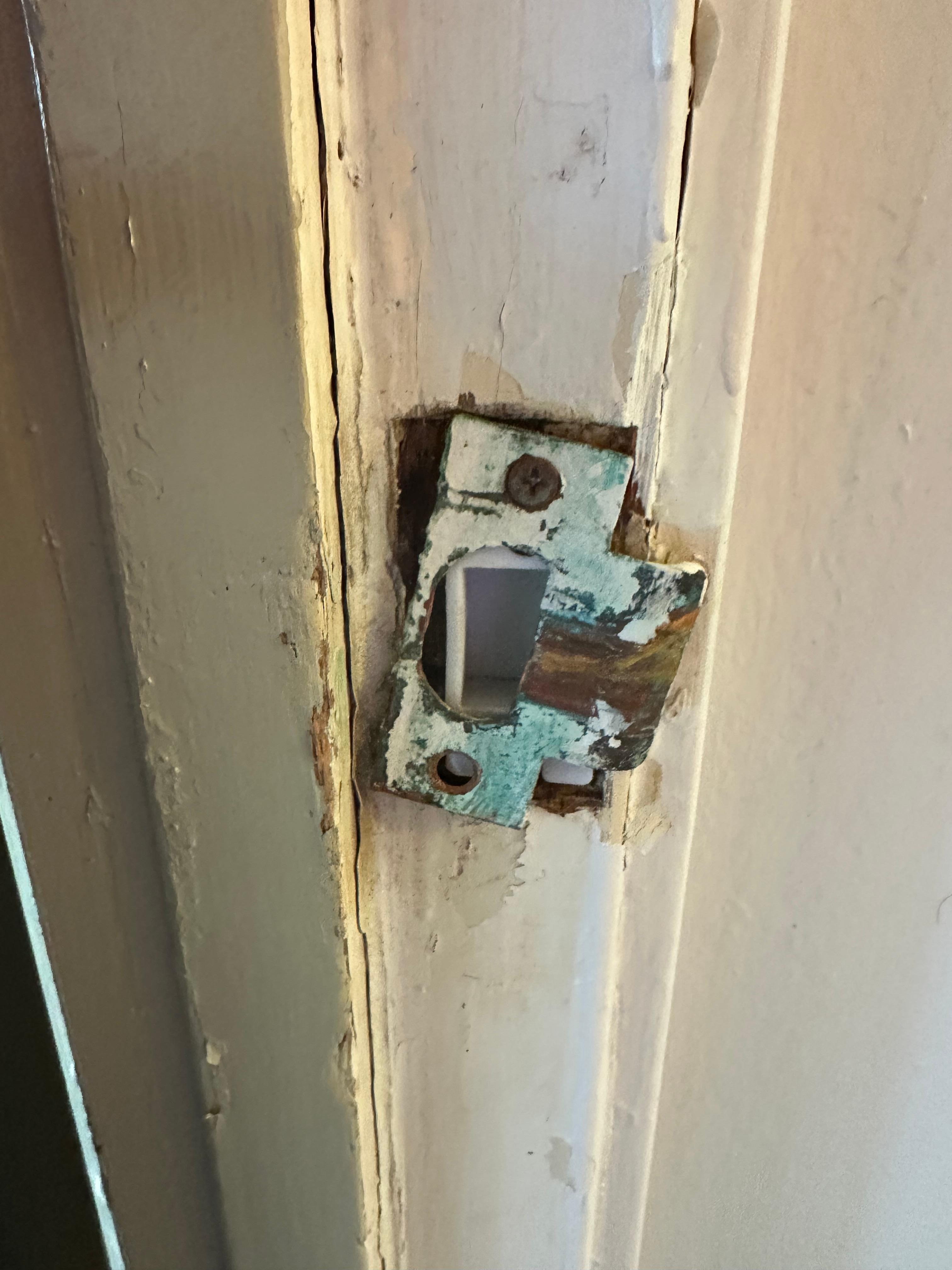 Broken strike plate on front door