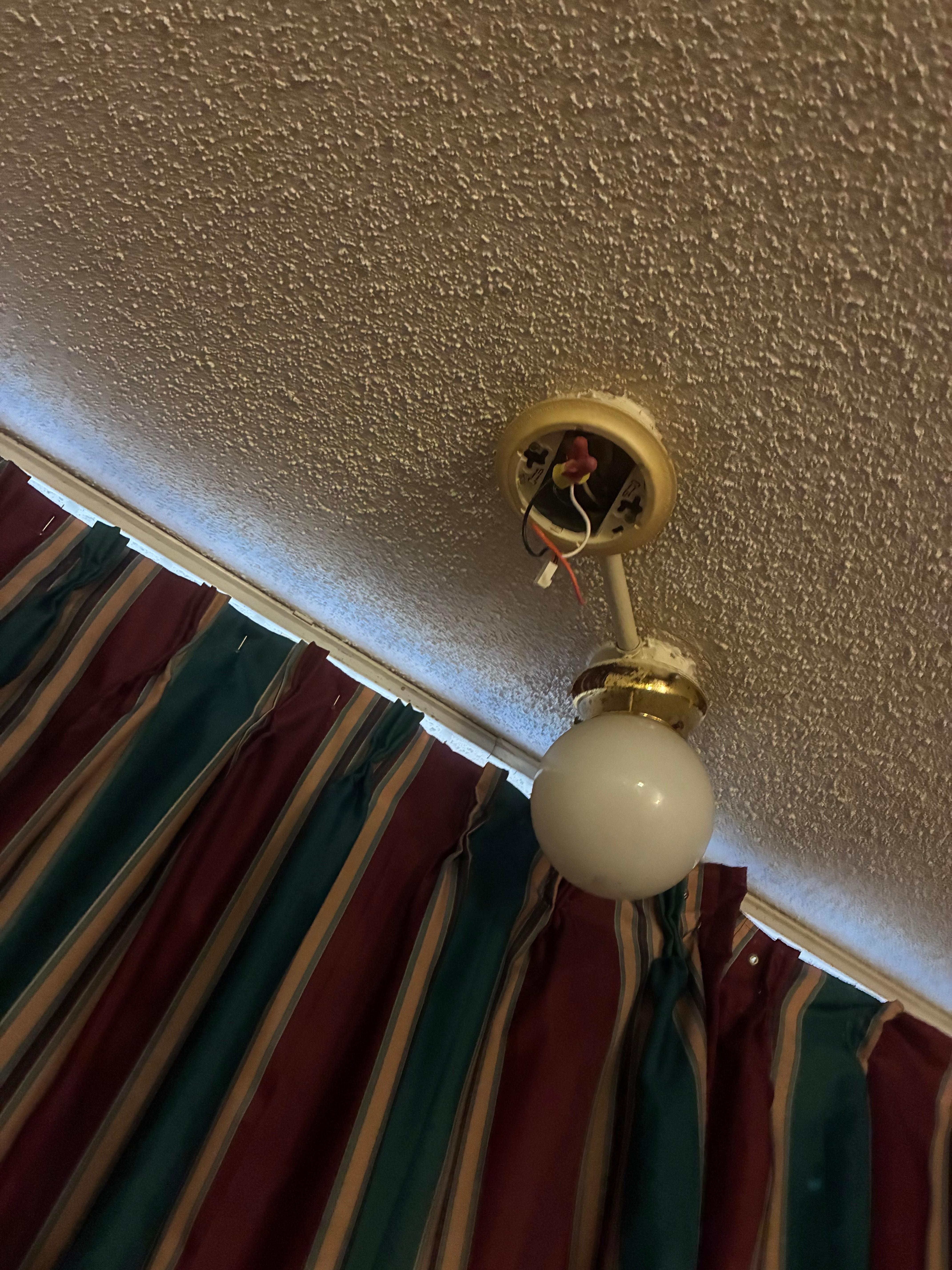 Live wires hanging from fixture