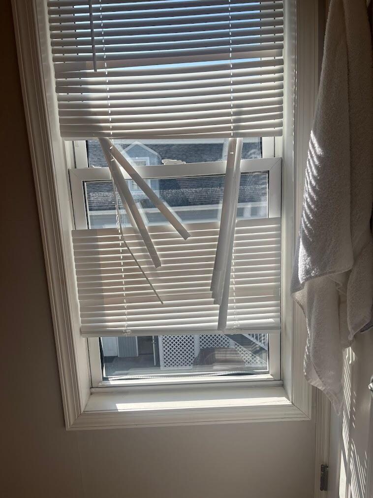 View of the bathroom window gaps from the shower.