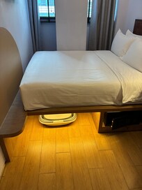 Nano queen. There is a bucket under the bed. It’s probably for laundry.