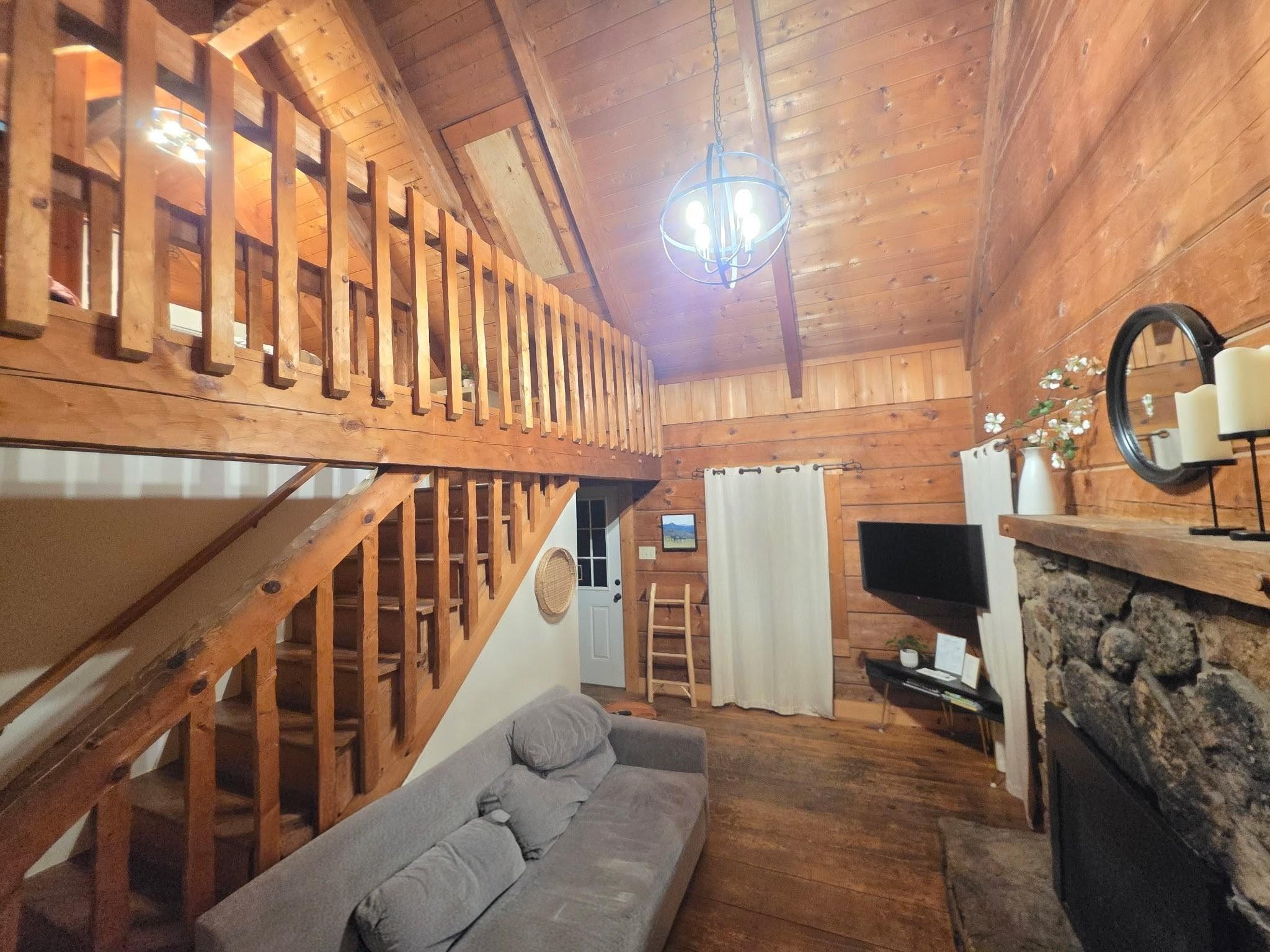 Living room and stairs to loft bedroom