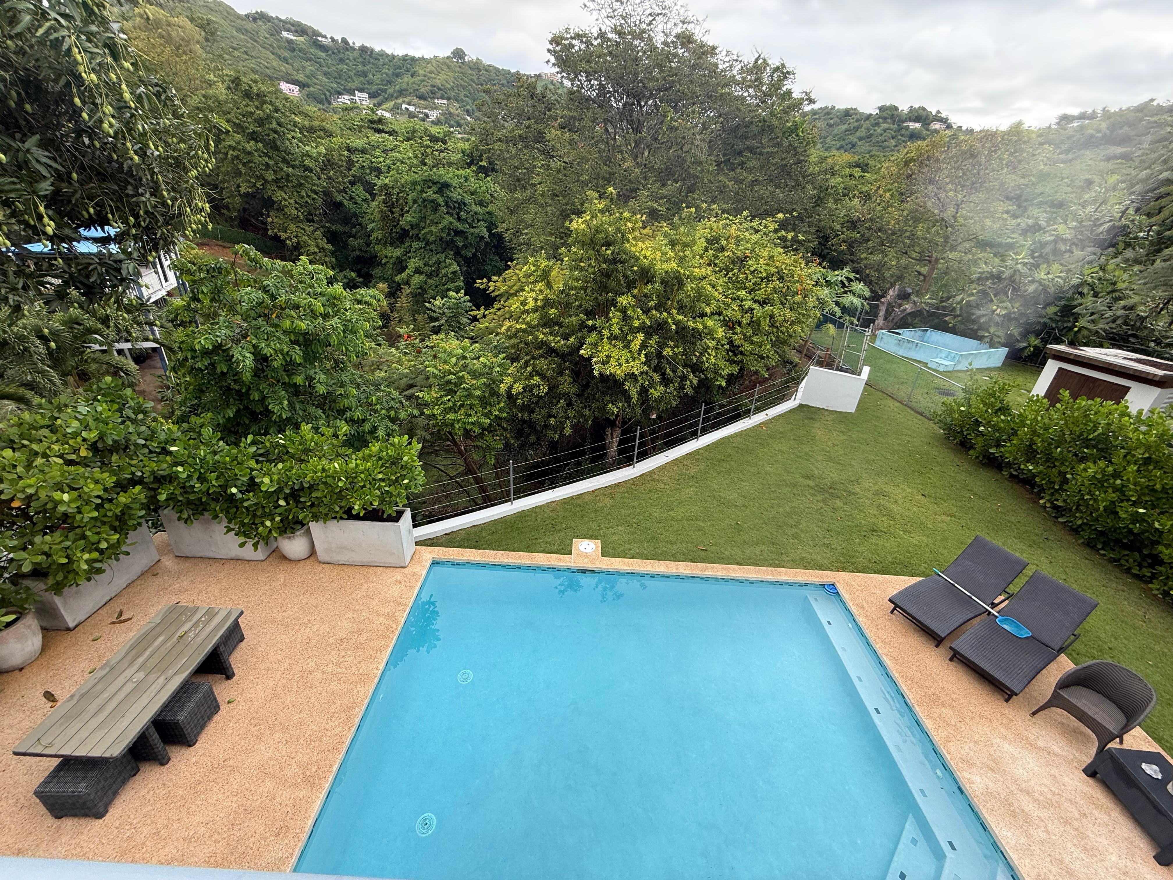 Looking down at pool from upstairs balcony