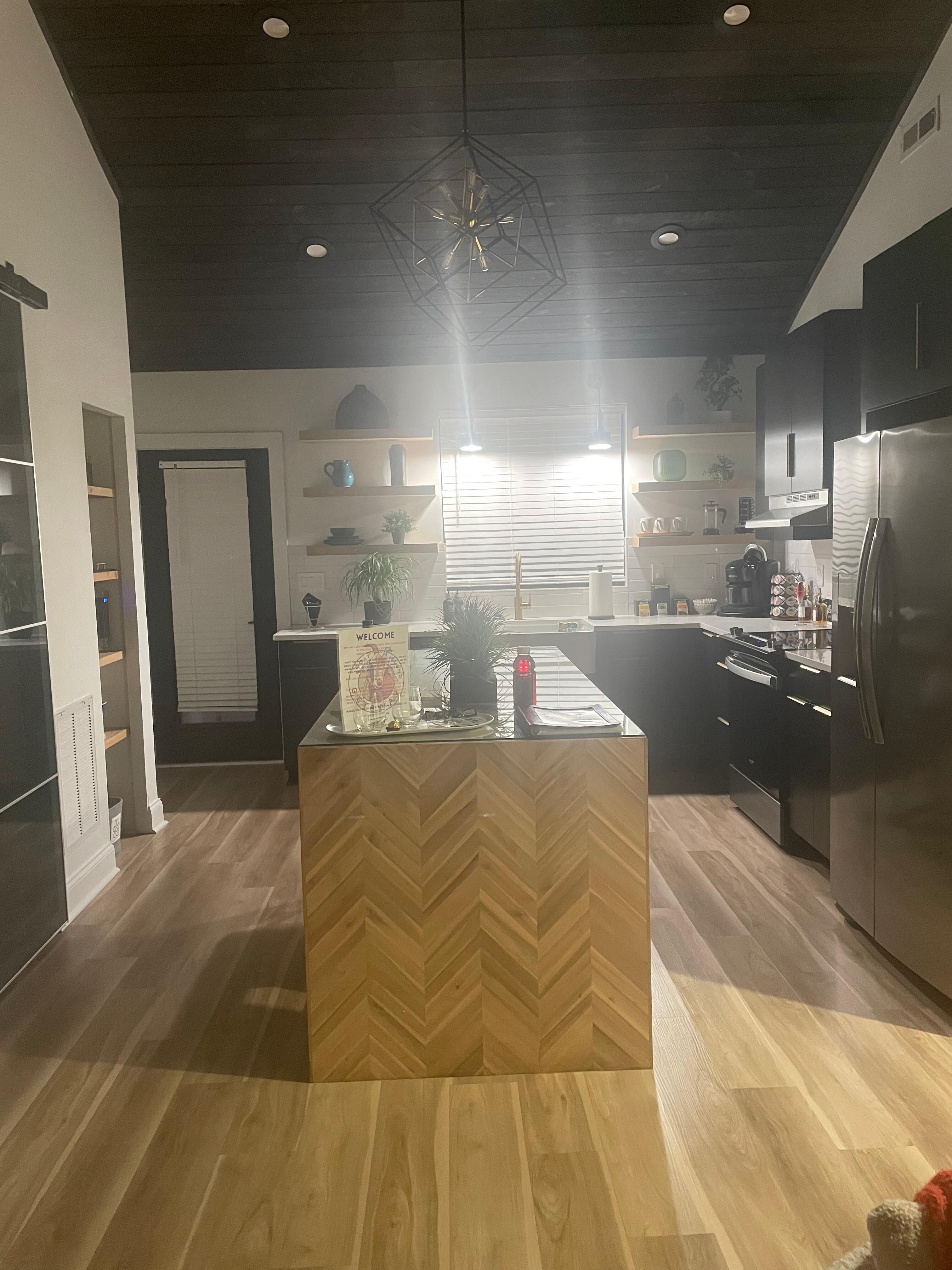 The island in the kitchen is one of a kind. There is even a coffee bar with all the fixings.