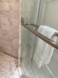 Dirty glass and towel that was just folded