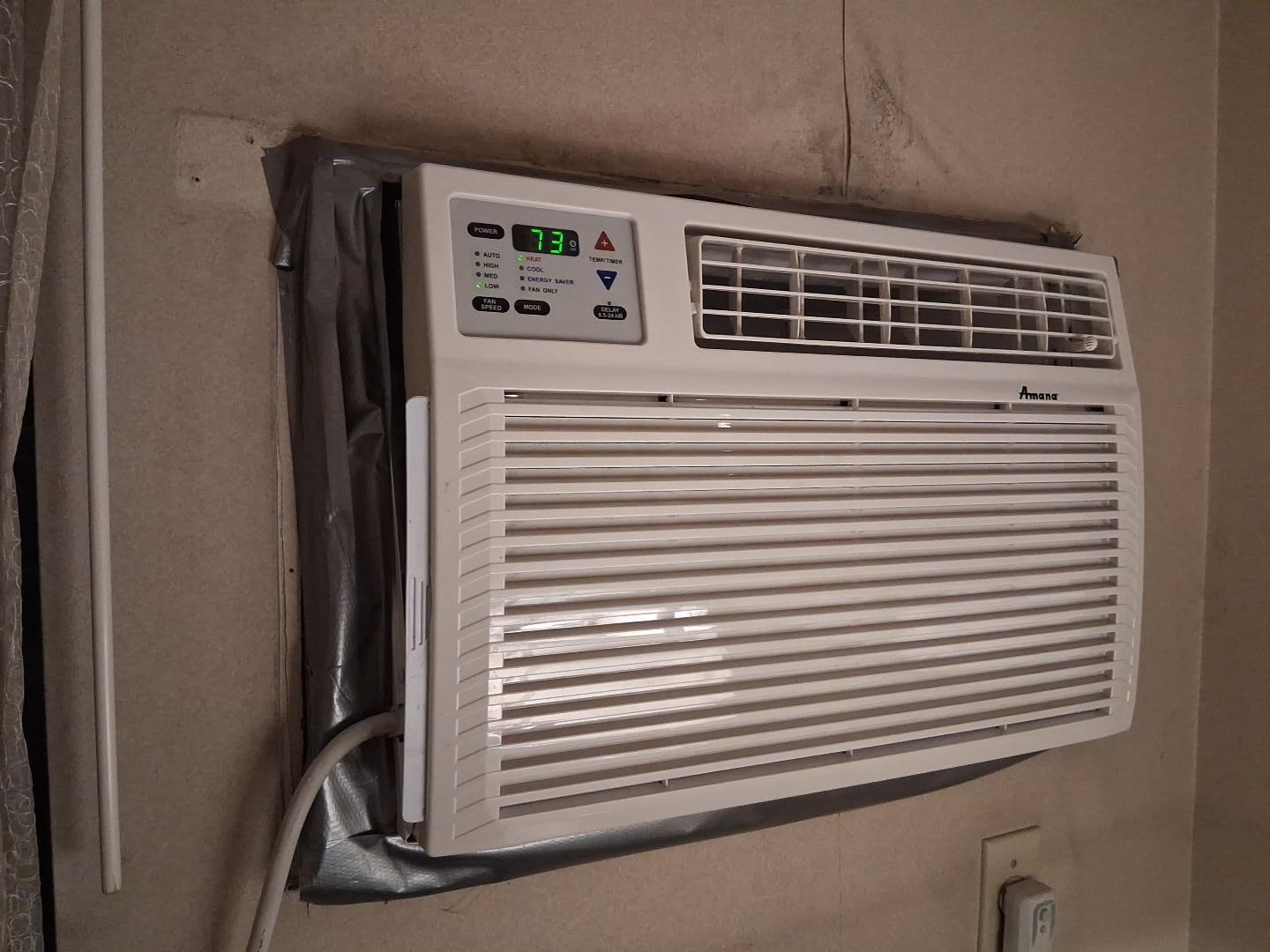 Old heat/air unit in old room.