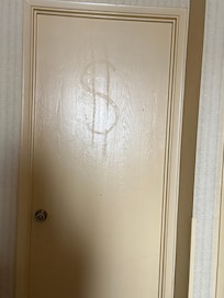 I have absolutely no idea why there is a dollar sign on the door.