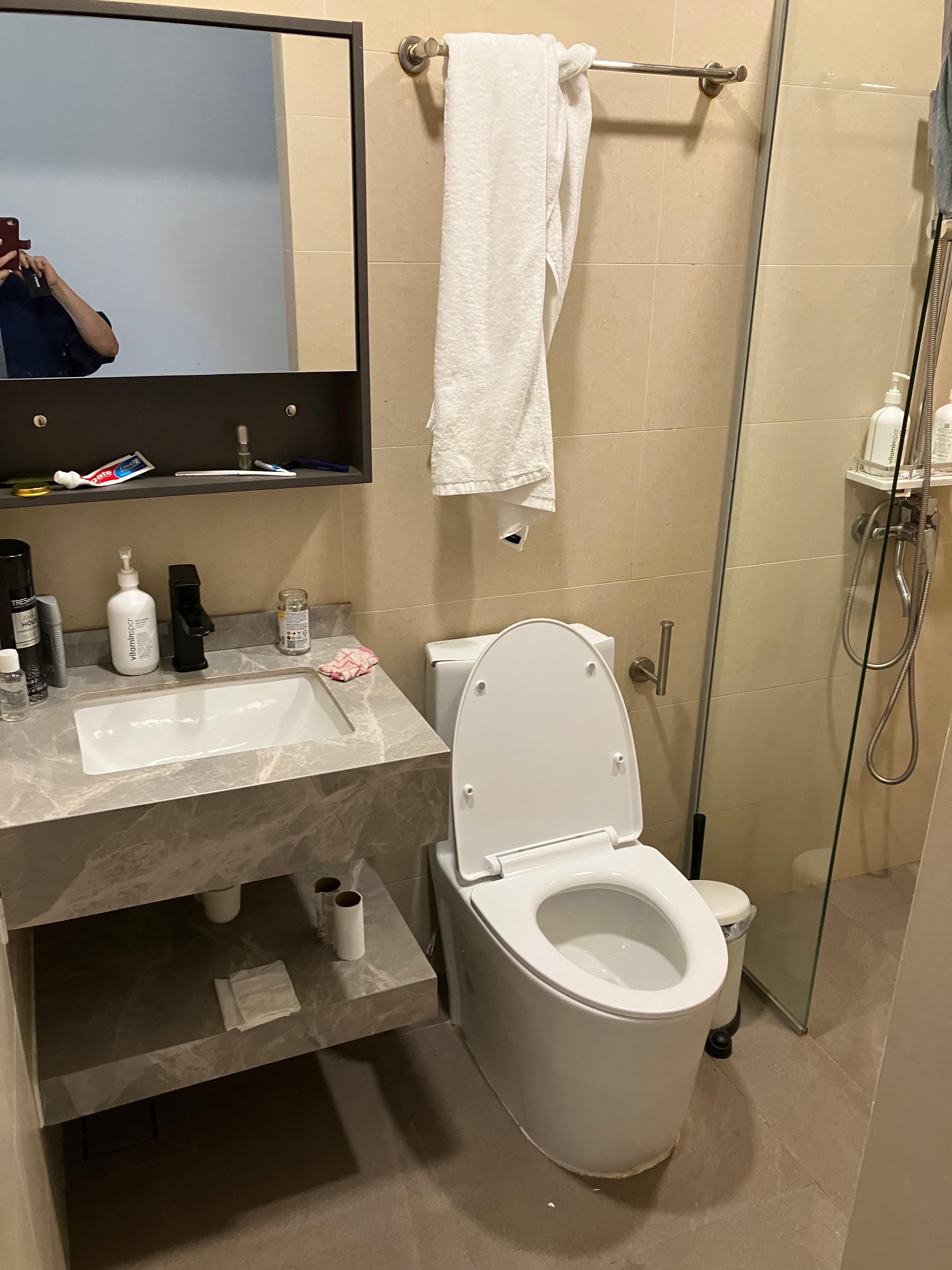 Clean bathroom, just some construction cement accumulate at the corner.