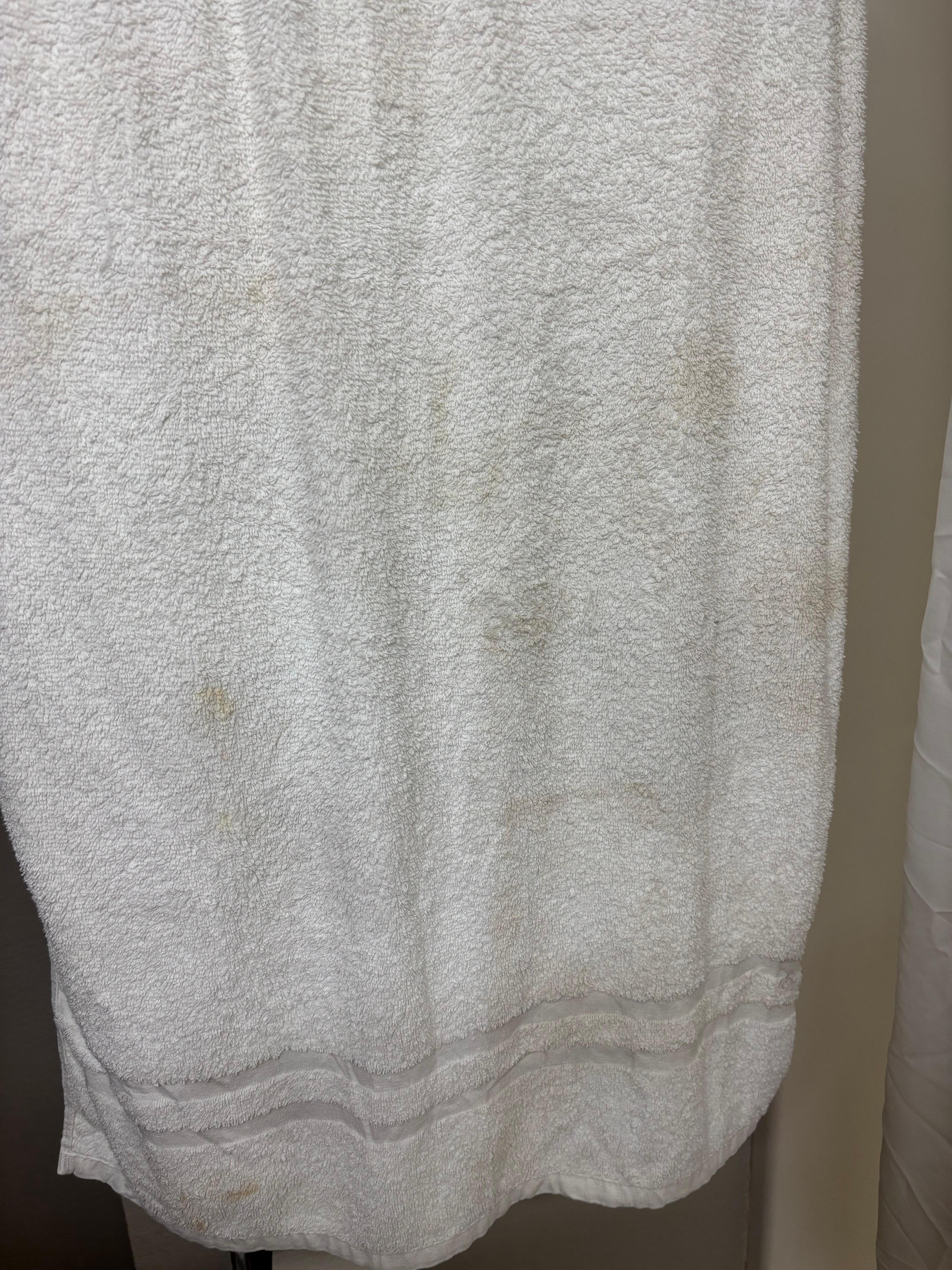 Towel….kind of speaks for itself. Stains. We did not use it, we had our own.