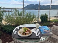 Delicious Cruffle and a view from their patio looking out to the sea
