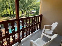 Balcony for our room with a view of the pool & river.