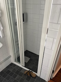 Shoe in photo for size comparison. Small shower but sufficient.