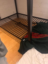 Center of bottom bunk completely caved in.