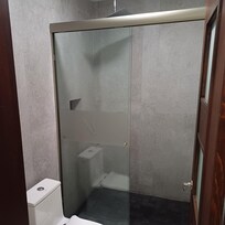 Walk-in shower with rainfall shower head