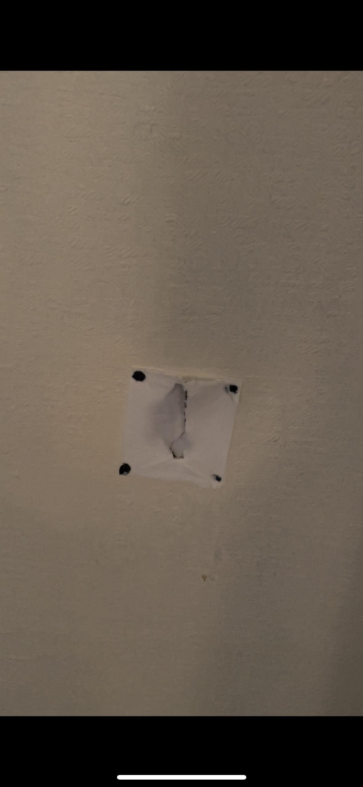 Hole in the wall. Loved the attempted repair with what appeared to be paper and nails? 