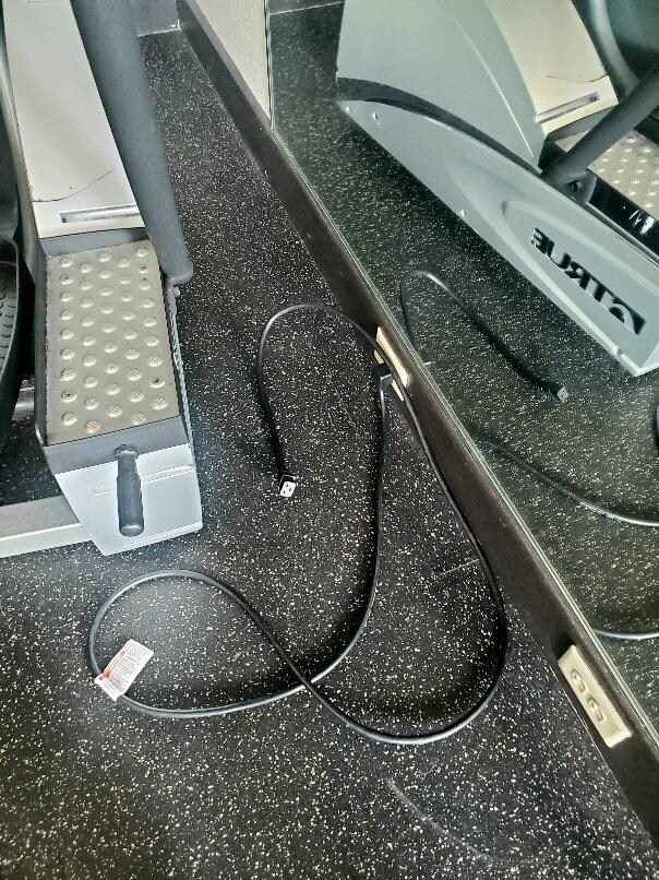 Cord from stair stepper unplugged from machine and from wall receptacle. 