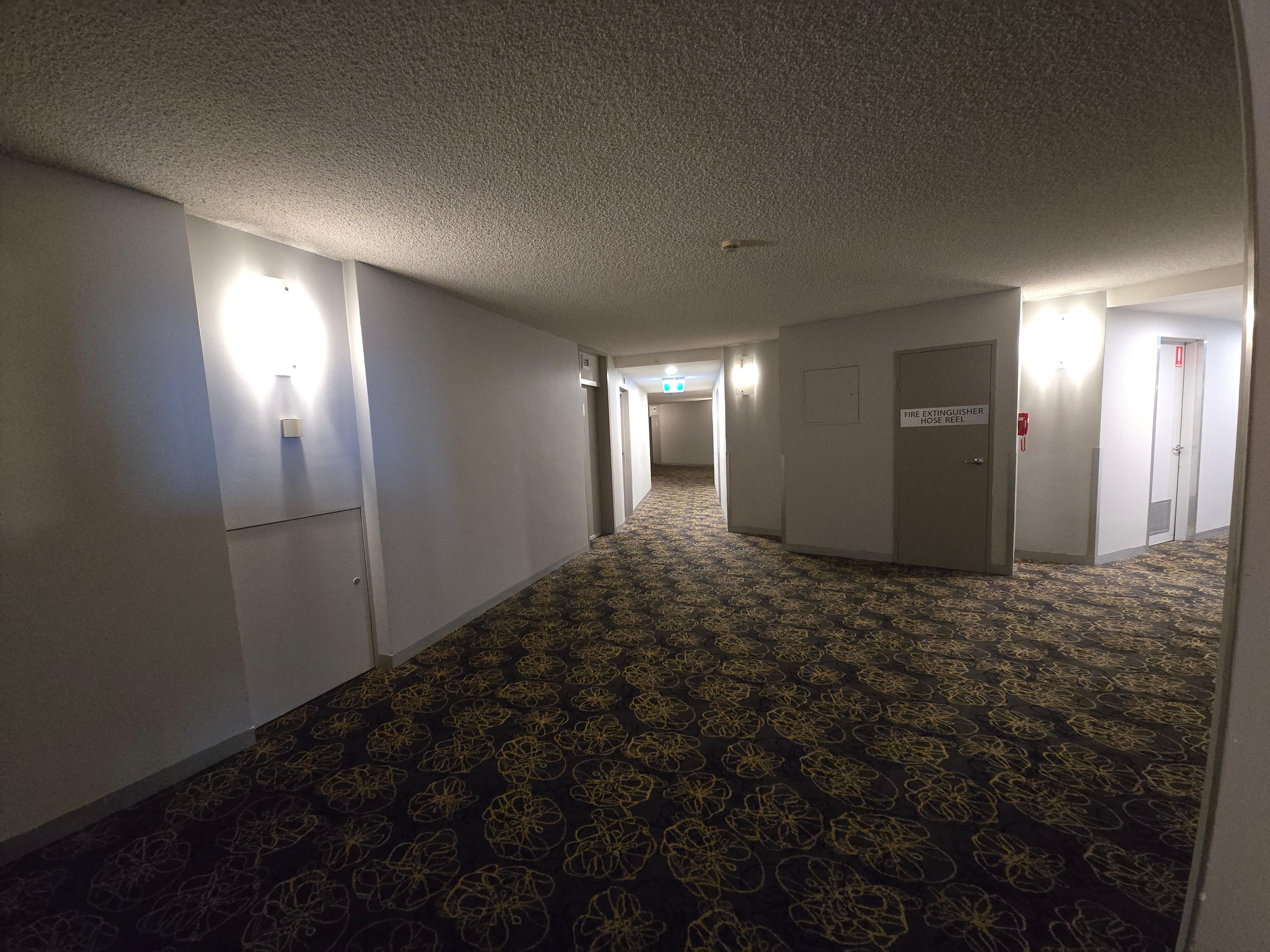 Very dark and dated corridor