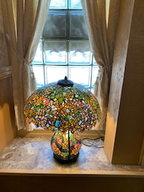 This beautiful lamp is in the front window and visible when you come down the stairs.