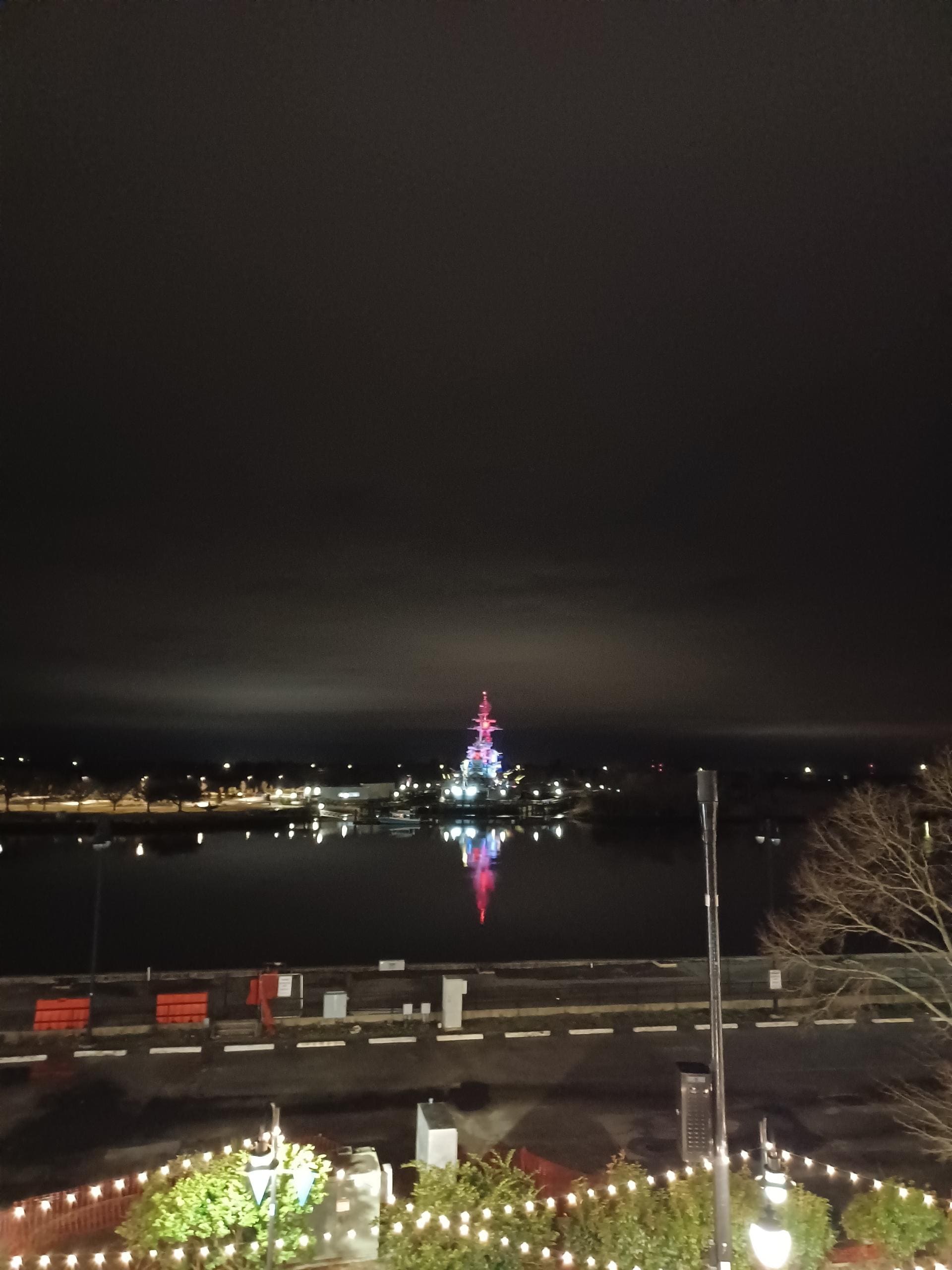 Battleship lit up - Right across the river in front of the condo.