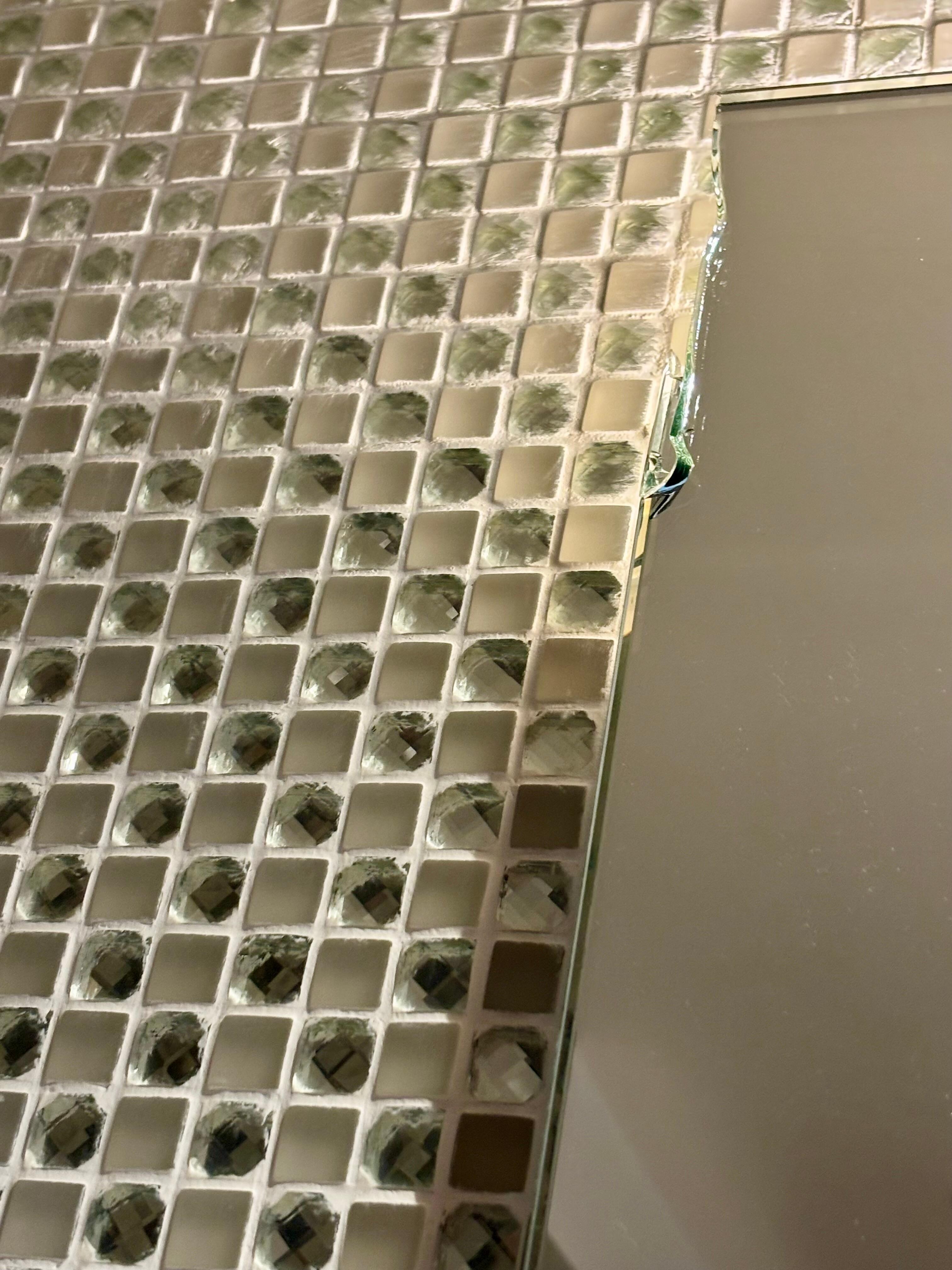 Cracked glass in bathroom (same on 3 corners)
