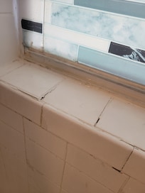 Gaps in the tile.