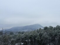 Enjoying coffee during some snowfall.