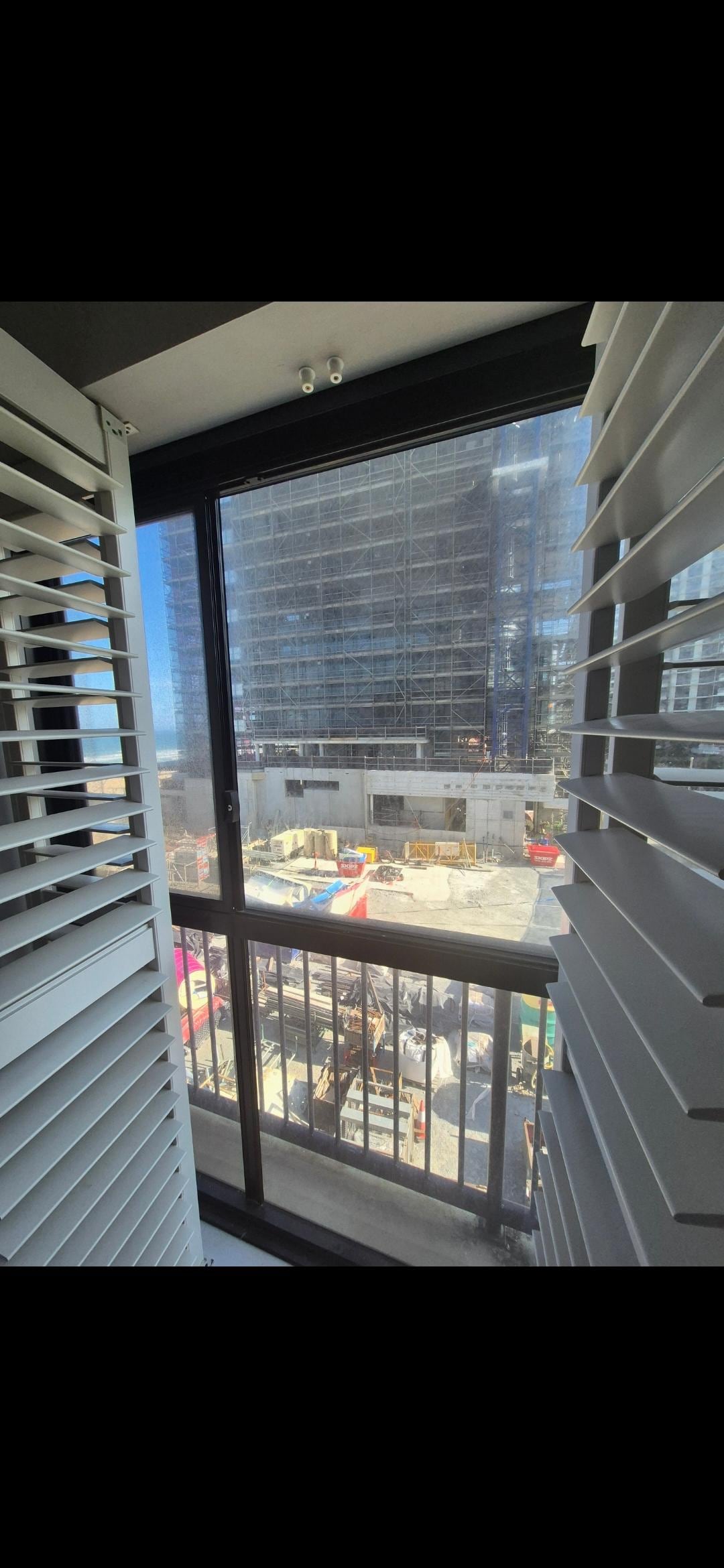 Heavy construction ditectly next door. The other side has a huge hole covering the whole site ready for excavation for another building. Full of sand blowing everywhere Dust everywhere. 