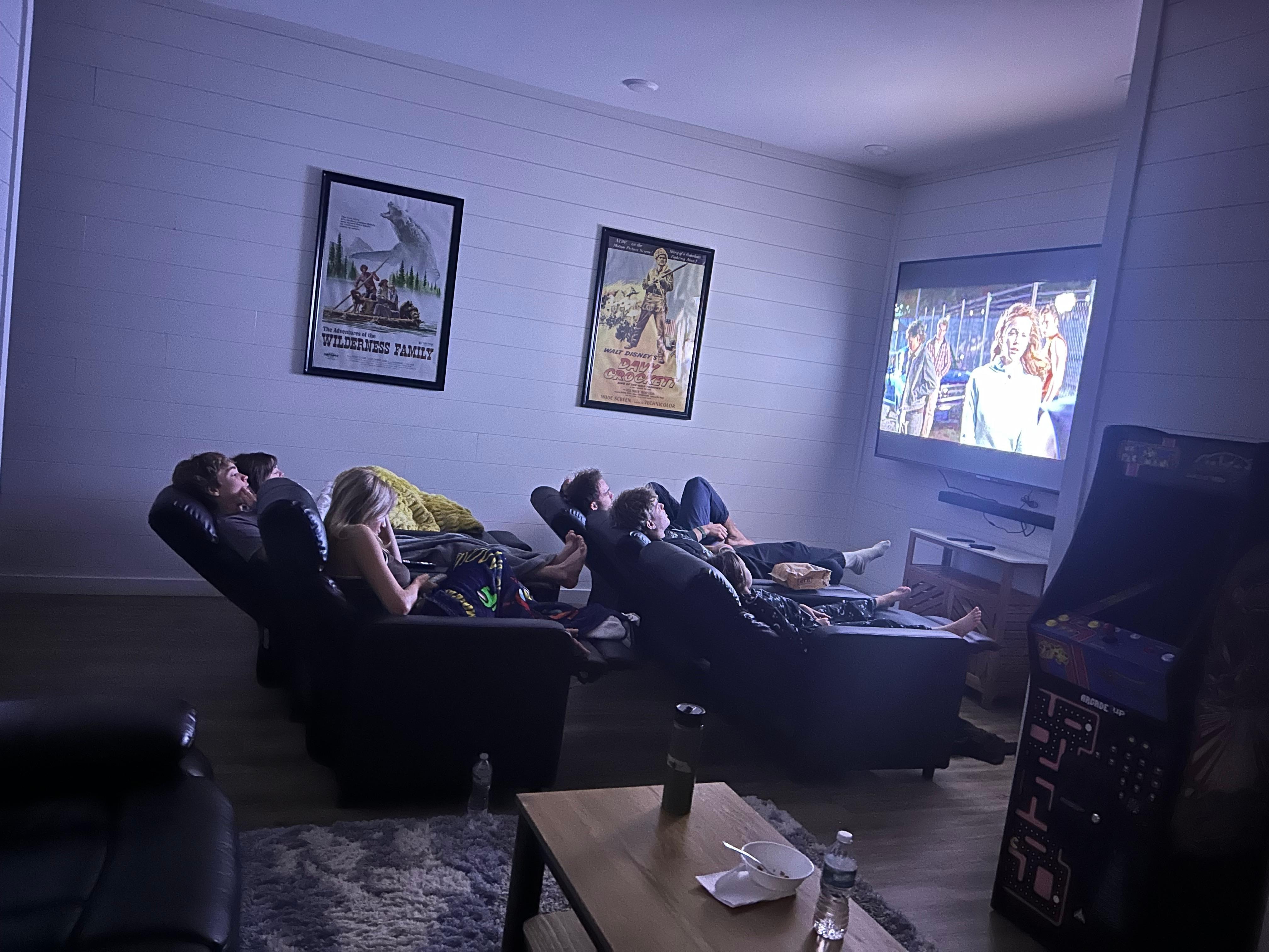 Comfortable theater seating with huge TV