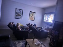 Comfortable theater seating with huge TV