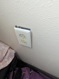 Electrical outlet separated from wall
