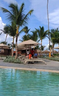 Staff drinking with guests while at work