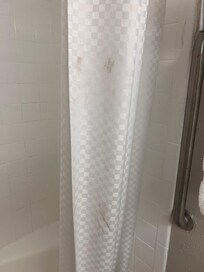 Black stains on shower curtain
