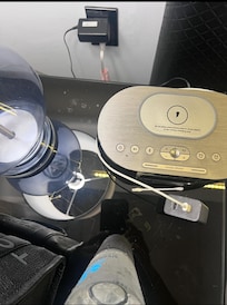 The nightstand beside the bed filthy had not been wiped clean after the last guest.