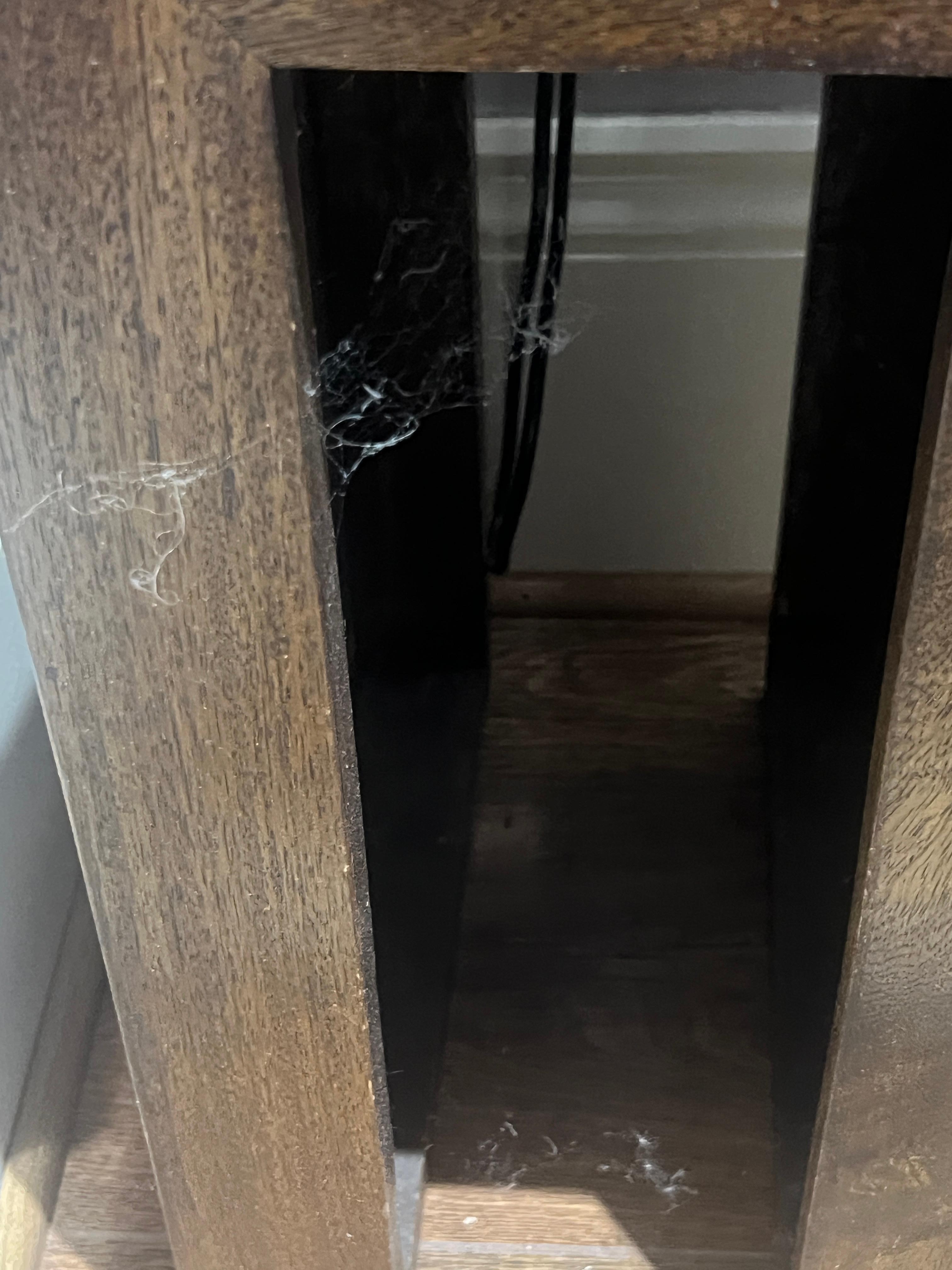 Loads of cobwebs on the legs of the bedside tables