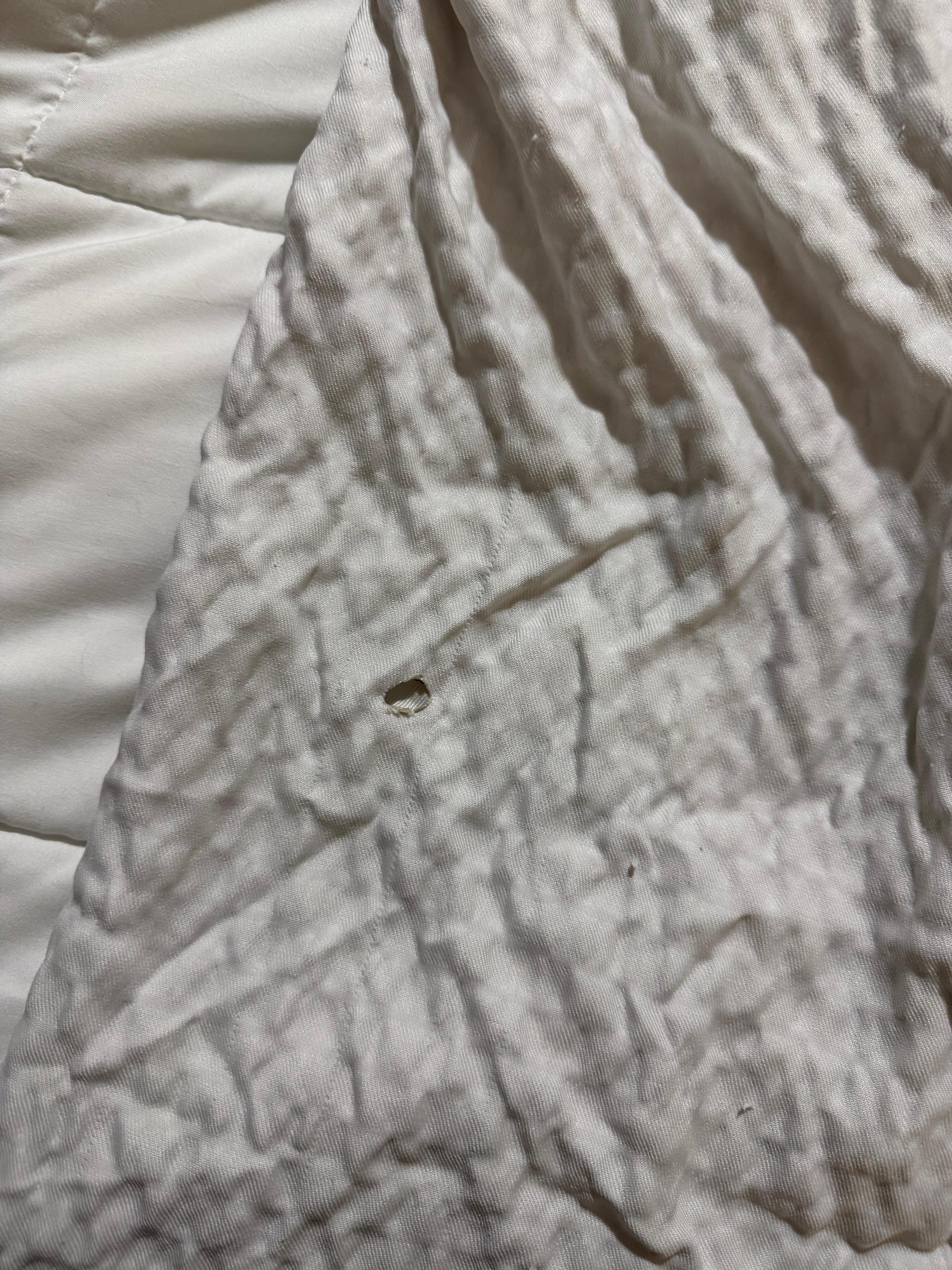 The blanket was burned with a cigarette