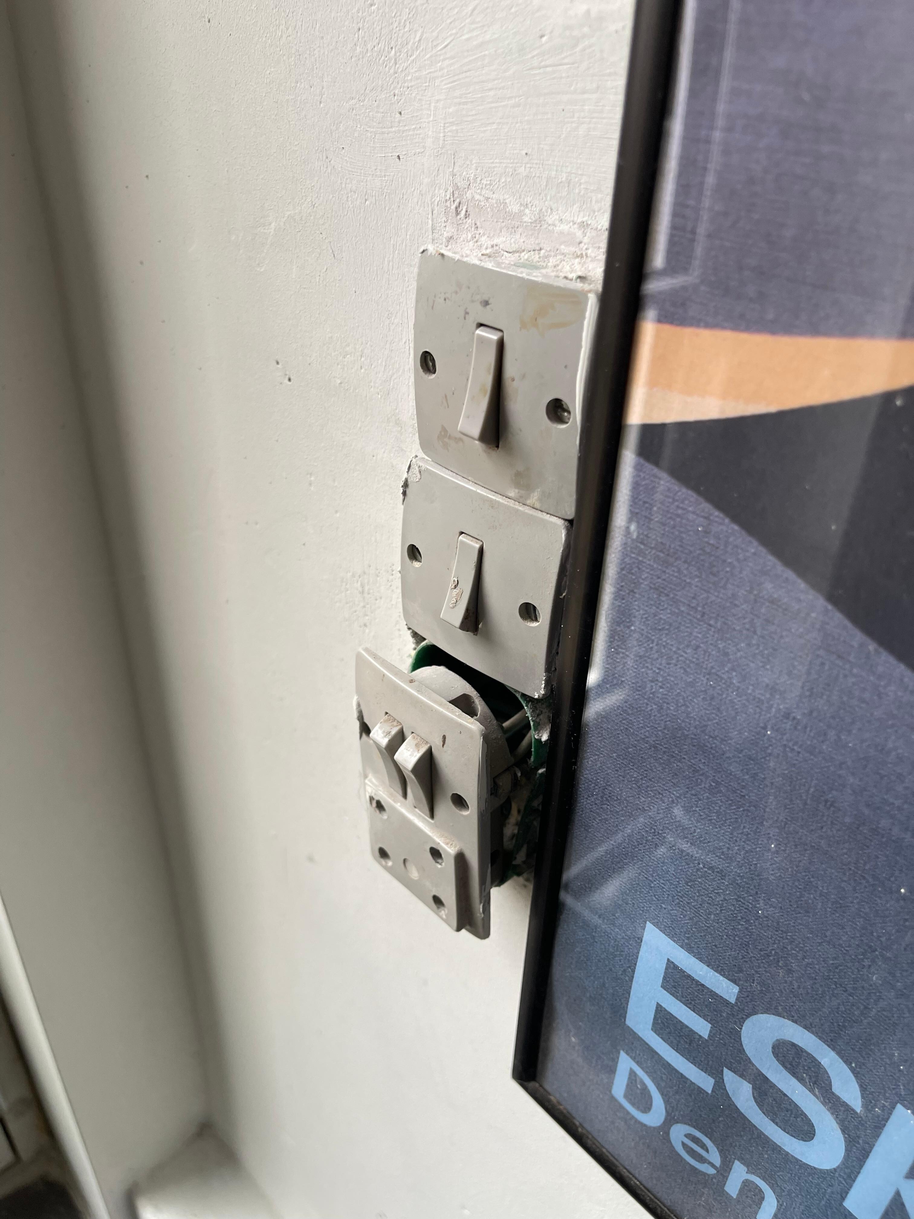 One power outlet was loose, hanging out of the wall with exposed wires