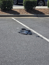 Smashed window in parking lot.