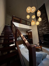 Looking up to the loft where the bed is