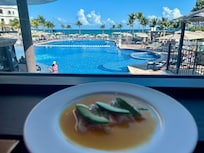 Delicious ceviche with an impressive view over the immense swimming pools.