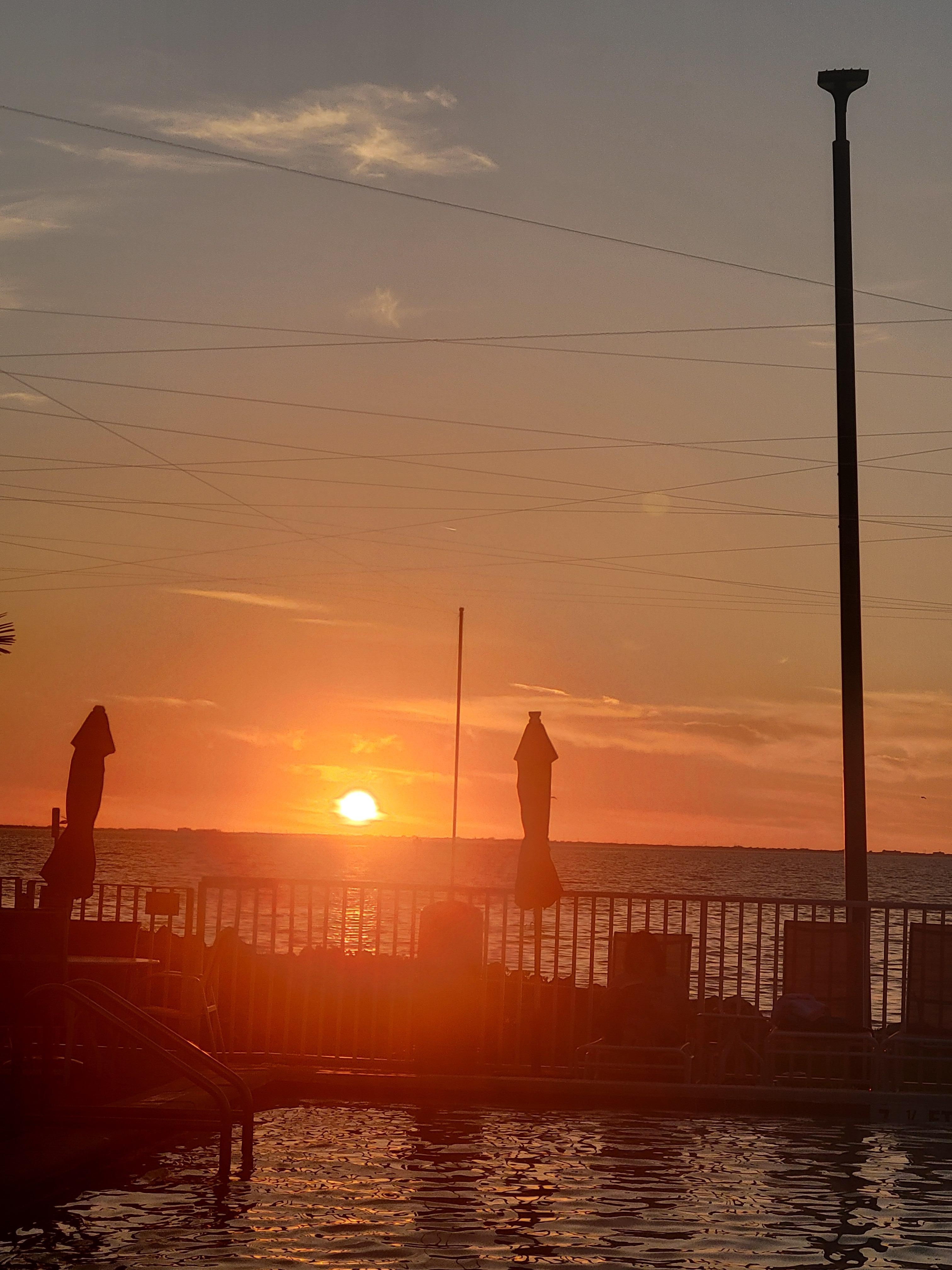 Beautiful sunsets from the pool area and the bar.