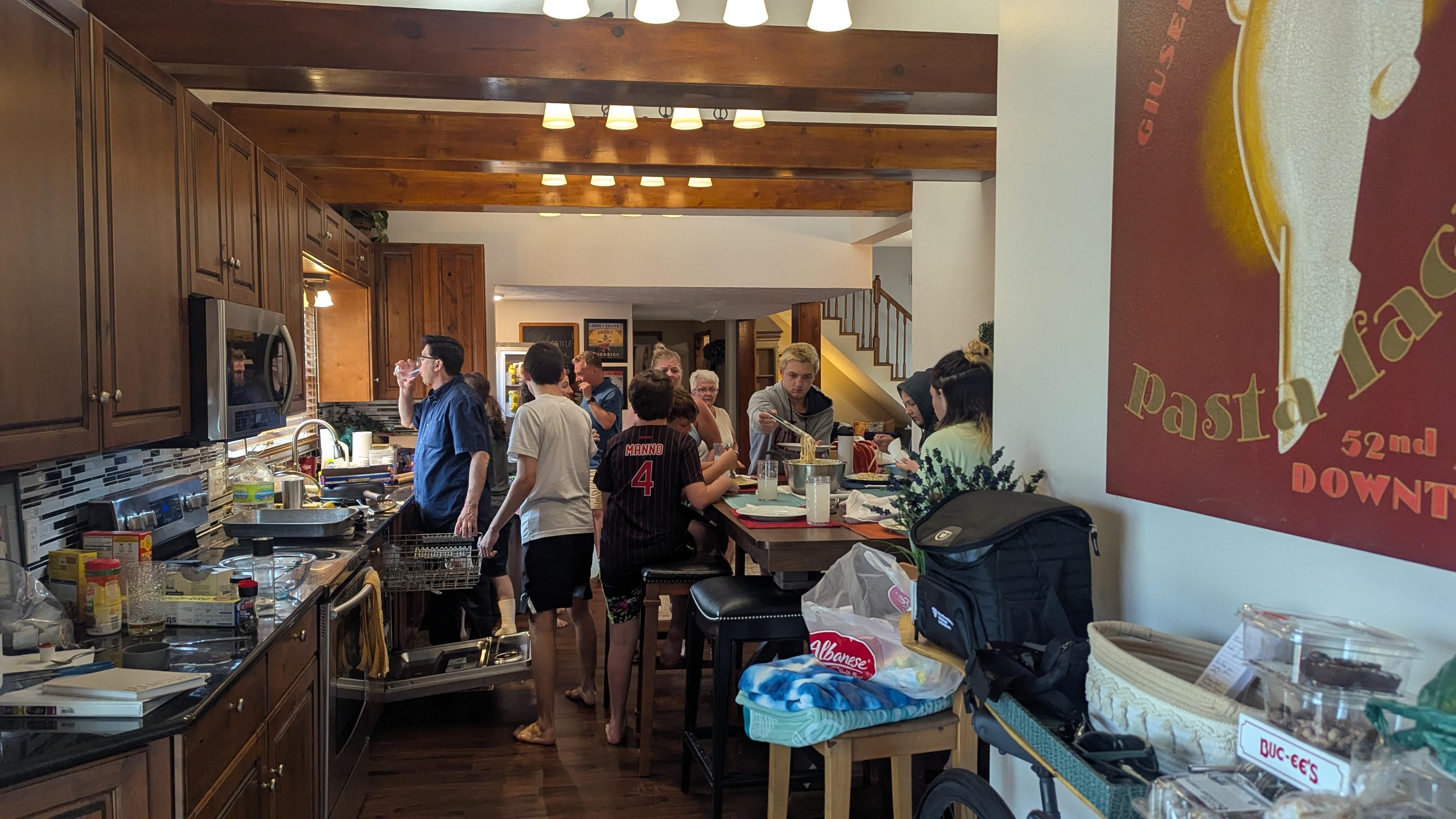 Everyone around in the kitchen together 