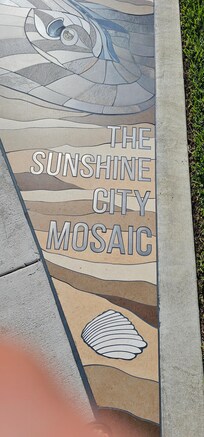 Cool mosaic sidewalk in park across street