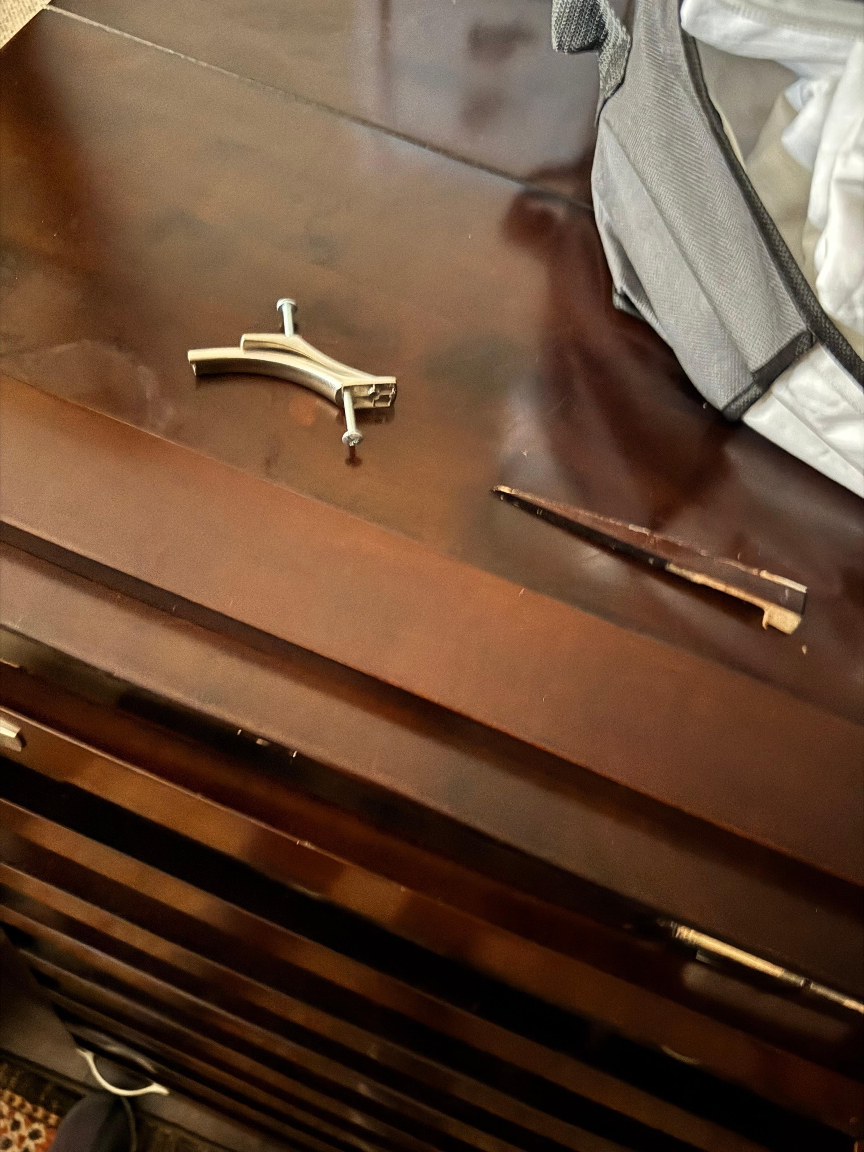 Hardware and broken wood just laying there.