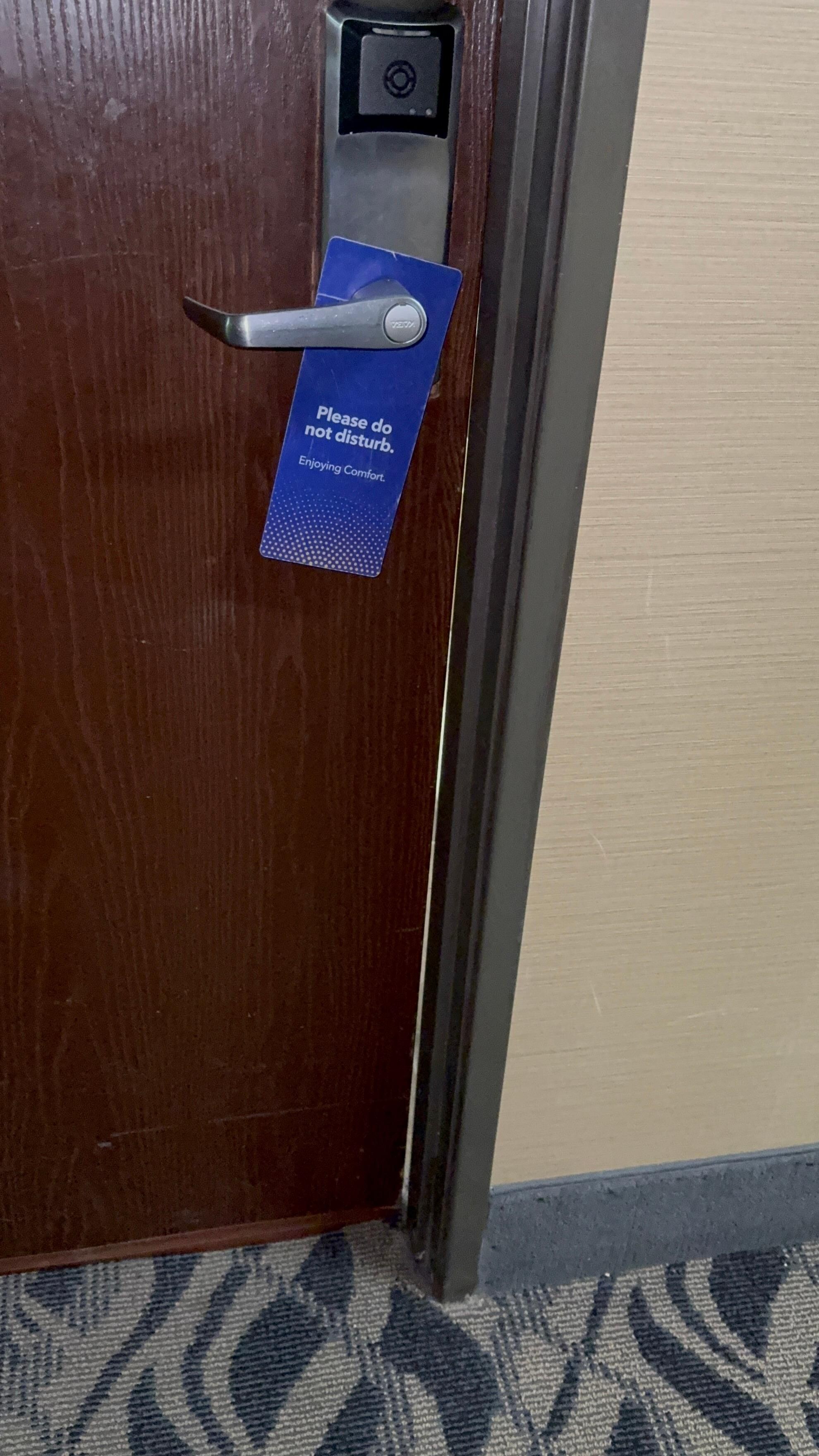 Bathroom could be seen from outside of the room. Door doesn’t close at bottom. Looks like it was kicked in. Room could easily be broken into with any key card or small pocket knife because of gap. 
They said it’s been like that for a long time.
