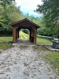 Covered bridge steps away from the home.
